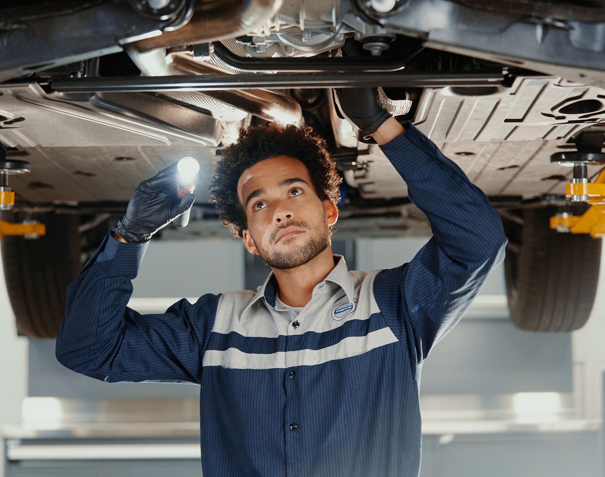 Man working under Volvo vehicle