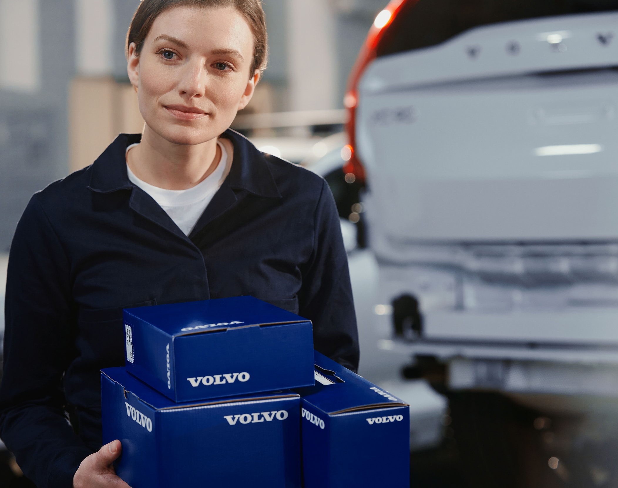 A man wearing a Volvo technicians suit